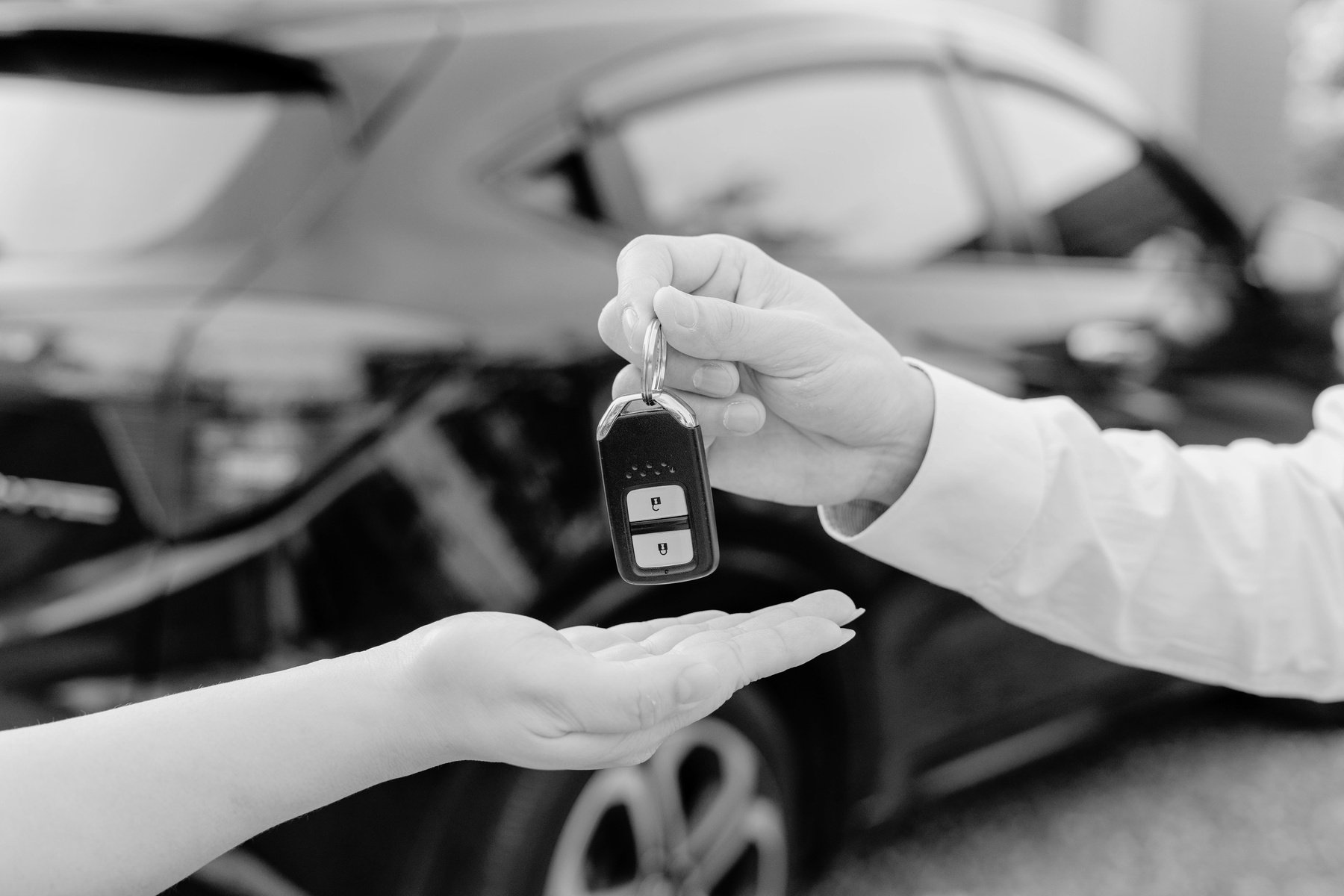 Person Handing Car Keys